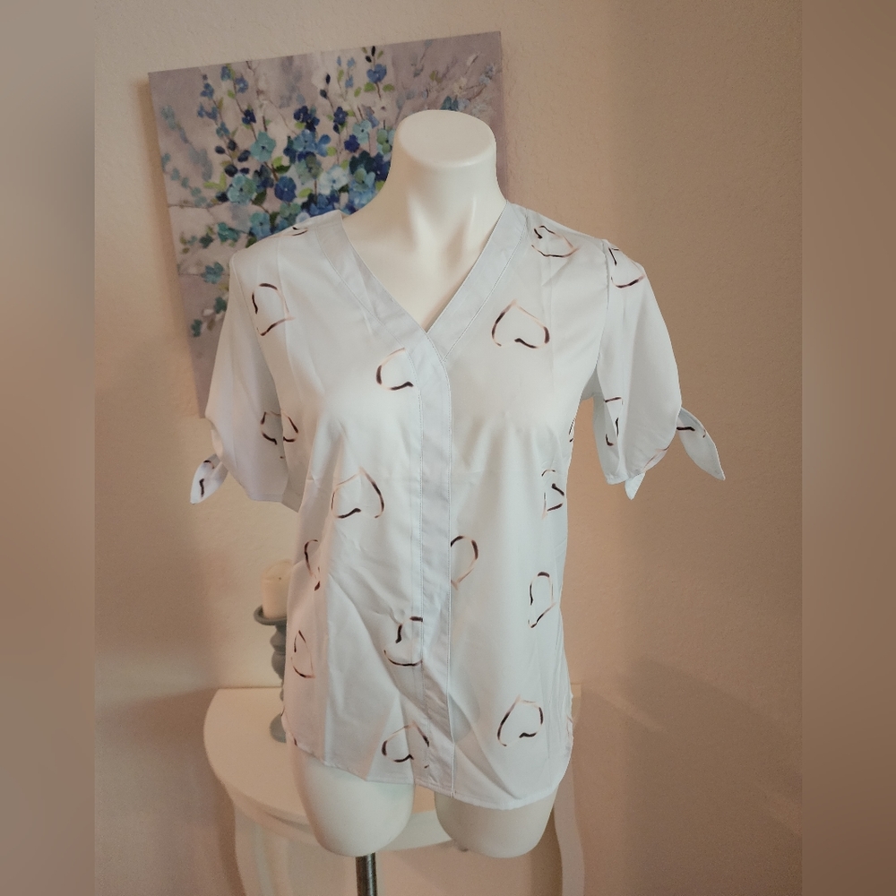 White blouse with brown hearts